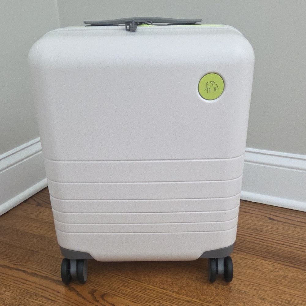 Monos X Drunk Elephant White Rolling Suitcase with Green Accent